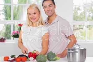 Blonde woman cooking with her husband