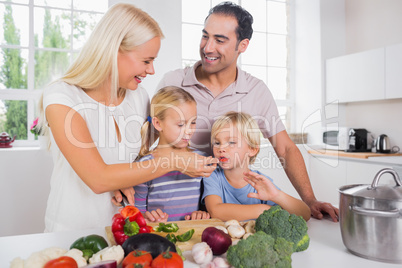 Family tasting vegetables