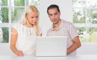 Couple using laptop
