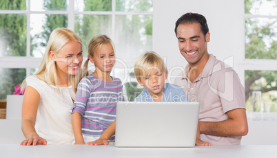 Family using a laptop together