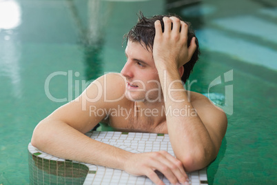 Man relaxing in swimming pool