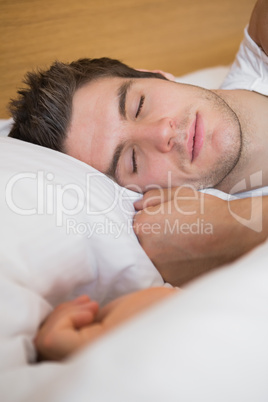 Man asleep in bed