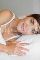 Woman smiling in bed