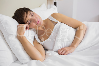 Attractive woman sleeping in bed