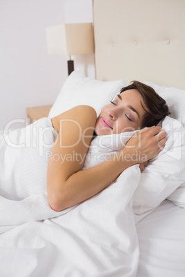 Woman sleeping comfortably in bed