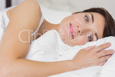 Female smiling in bed