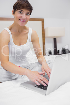 Smiling woman on the laptop