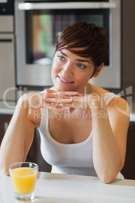 Woman posing with orange juice