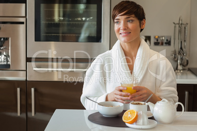 Happy woman having breakfast