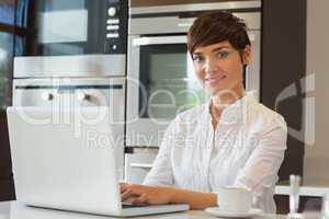 Smiling woman on the laptop