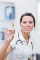 Female doctor holding an injection at hospital