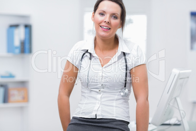 Confident female doctor at clinic