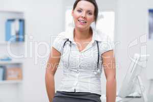 Confident female doctor at clinic