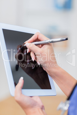 Doctor using digital tablet Doctor using digital tablet