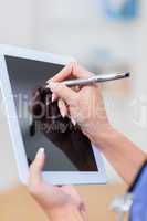 Doctor using digital tablet