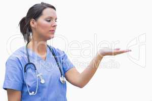 Female surgeon holding out open palm
