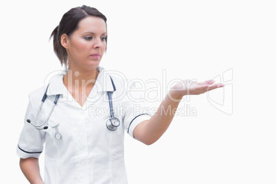 Female nurse holding out open palm