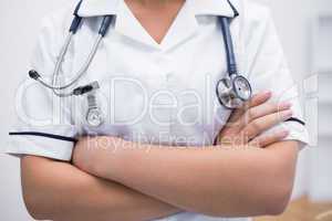 Female nurse in uniform wearing stethoscope around neck