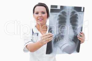 Portrait of young female nurse with x-ray