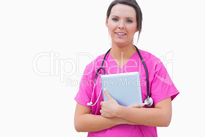 Portrait of nurse with digital tablet standing