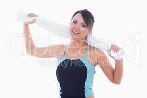 Portrait of woman in sportswear holding towel around neck