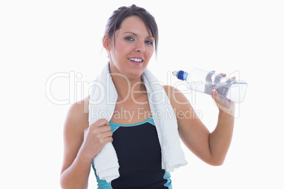 Portrait of woman in sportswear drinking water