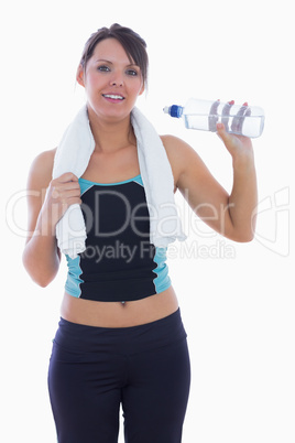 Portrait of woman in sportswear drinking water