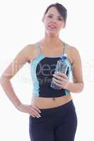 Portrait of woman in sportswear holding water bottle