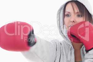 Serious young woman in boxing stance