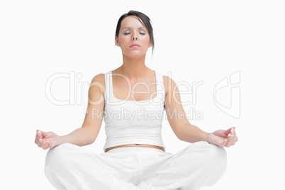 Young woman sitting in lotus position