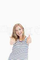 Portrait of cheerful young woman gesturing double thumbs up
