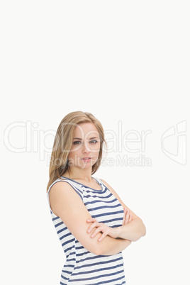 Portrait of serious and confident casual woman with arms crossed