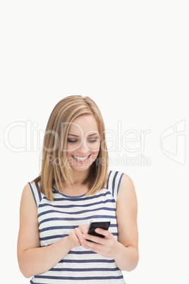 Casual young woman with smartphone