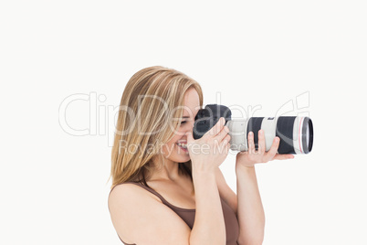 Side view of happy photographer with photographic camera