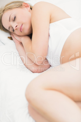 Pretty woman sleeping in bed