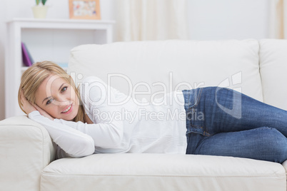 Portrait of casual woman lying on sofa Portrait of casual woman lying on sofa