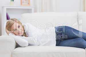 Portrait of casual woman lying on sofa