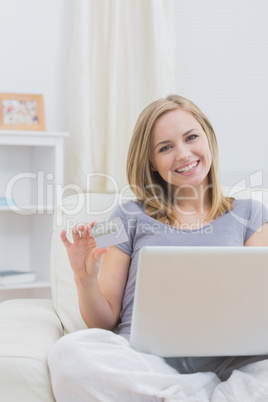 Portrait of casual woman doing online shopping at home