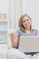 Portrait of casual woman doing online shopping at home