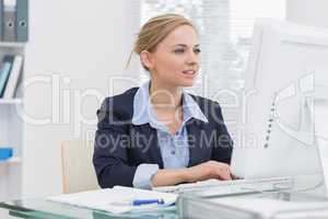 Business woman working on computer at office