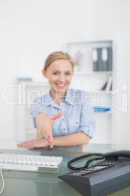 Business woman offering handshake at office