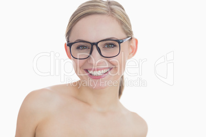 Close-up portrait of happy young woman wearing glasses