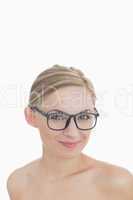 Close-up portrait of happy young woman wearing glasses