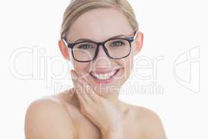 Close-up portrait of happy young woman wearing glasses