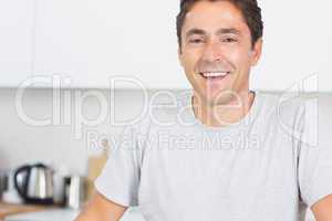 Happy man in kitchen