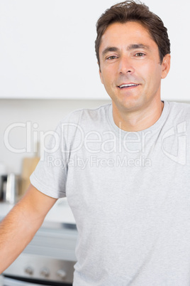 Man smilimg in kitchen