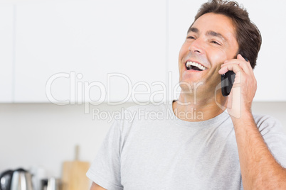 Man laughing on the phone