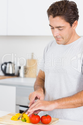 Man slicing vegetables