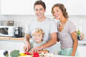 Happy family preparing vegetables