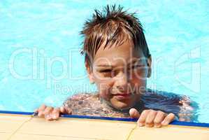 Young smiling boy in pool